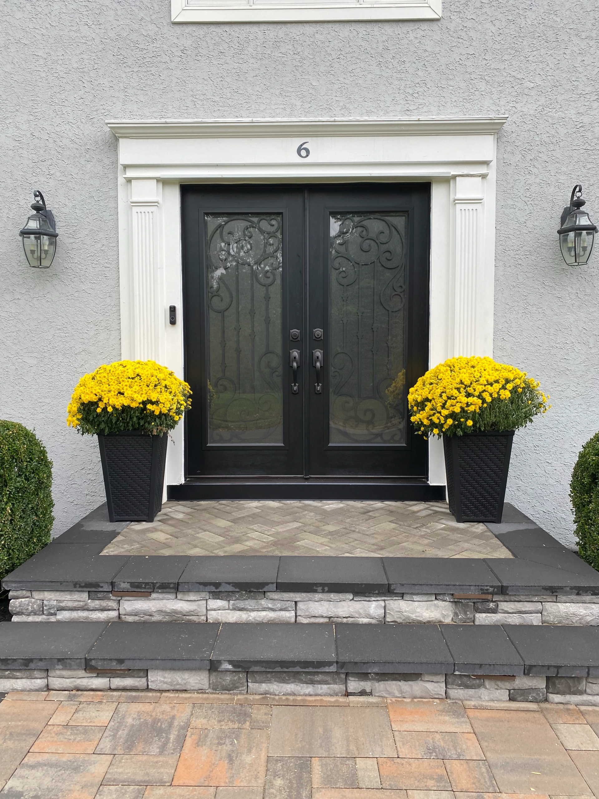Black double entry doors with ornamental glass