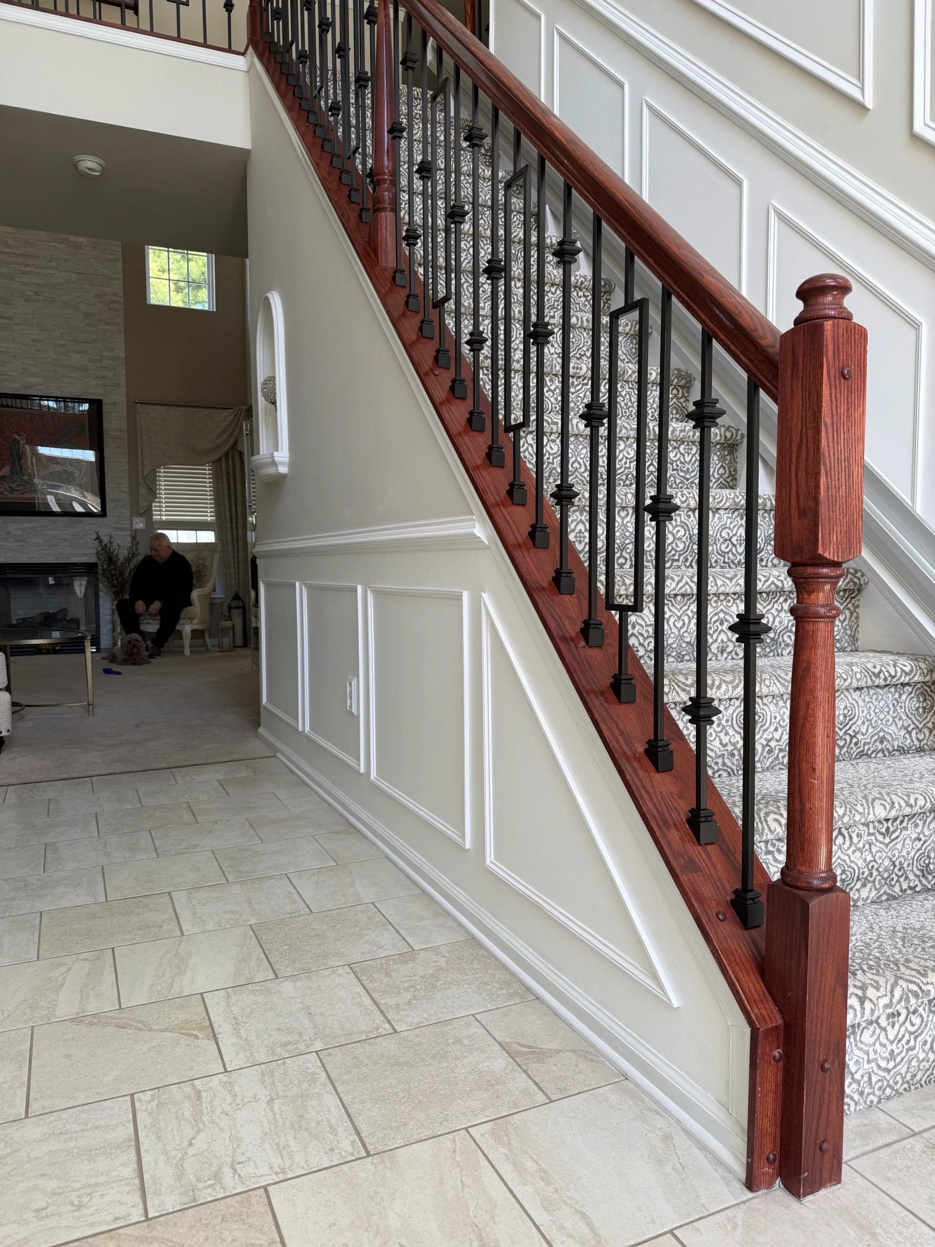 Geometric iron stair railing seen from below